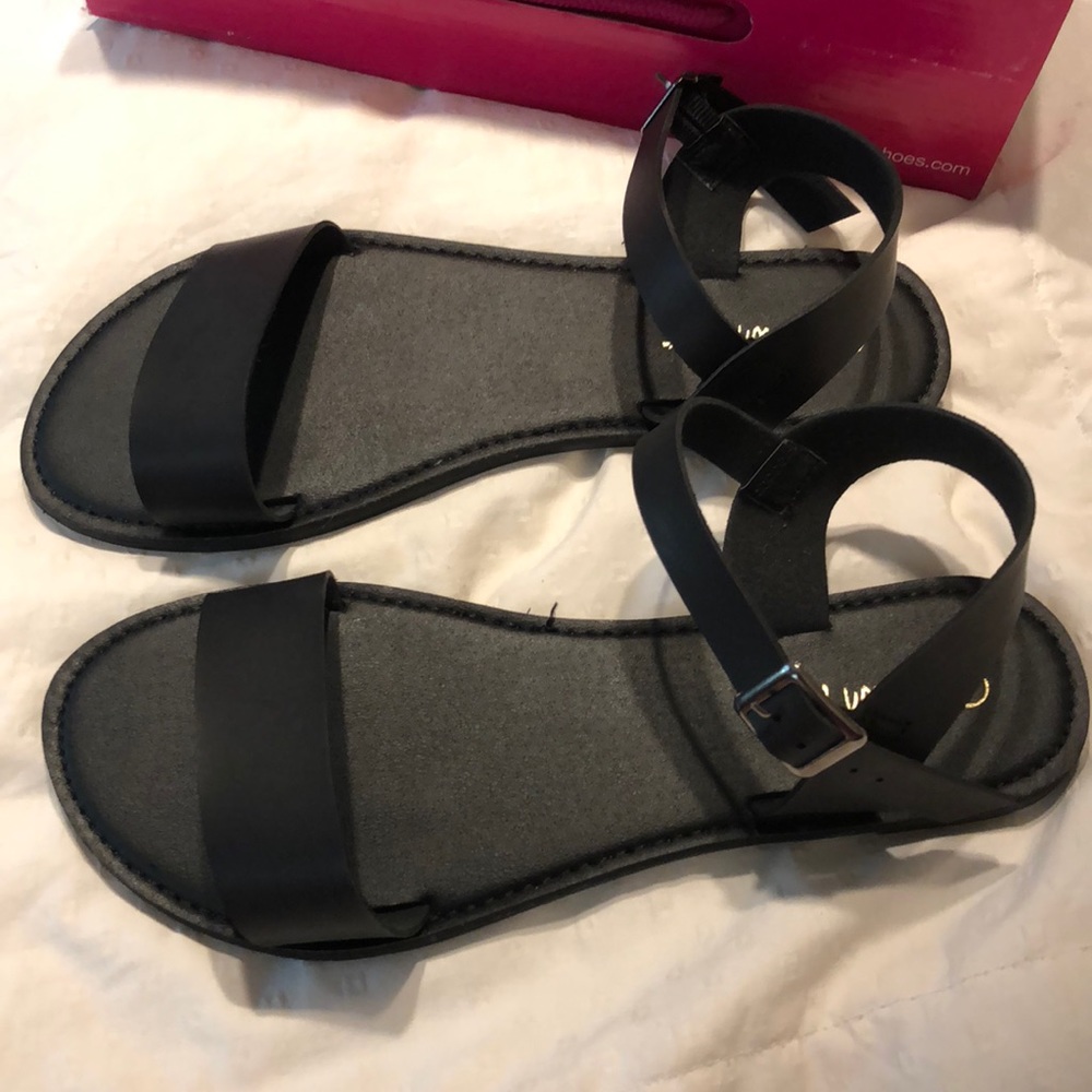 Black Sandals never worn.